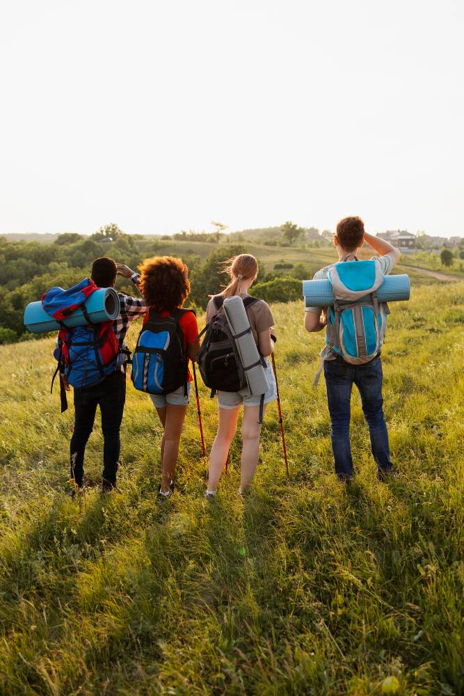 full-shot-people-wearing-backpacks